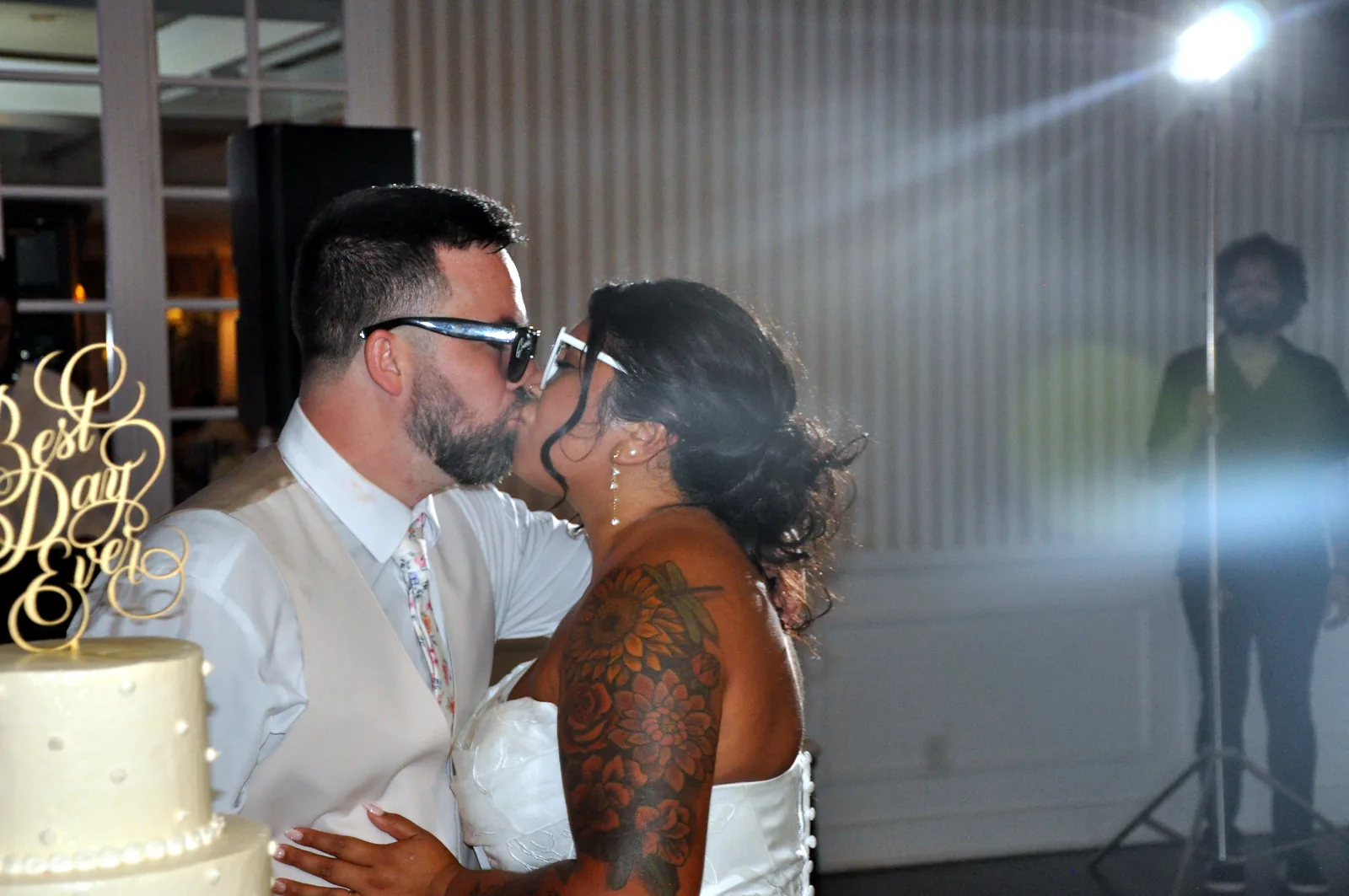 Newlyweds sharing a kiss at their reception