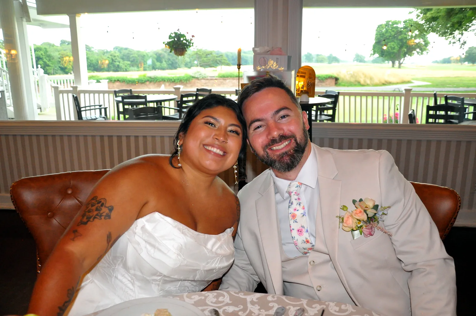 Newlyweds smiling together at their Long Island wedding