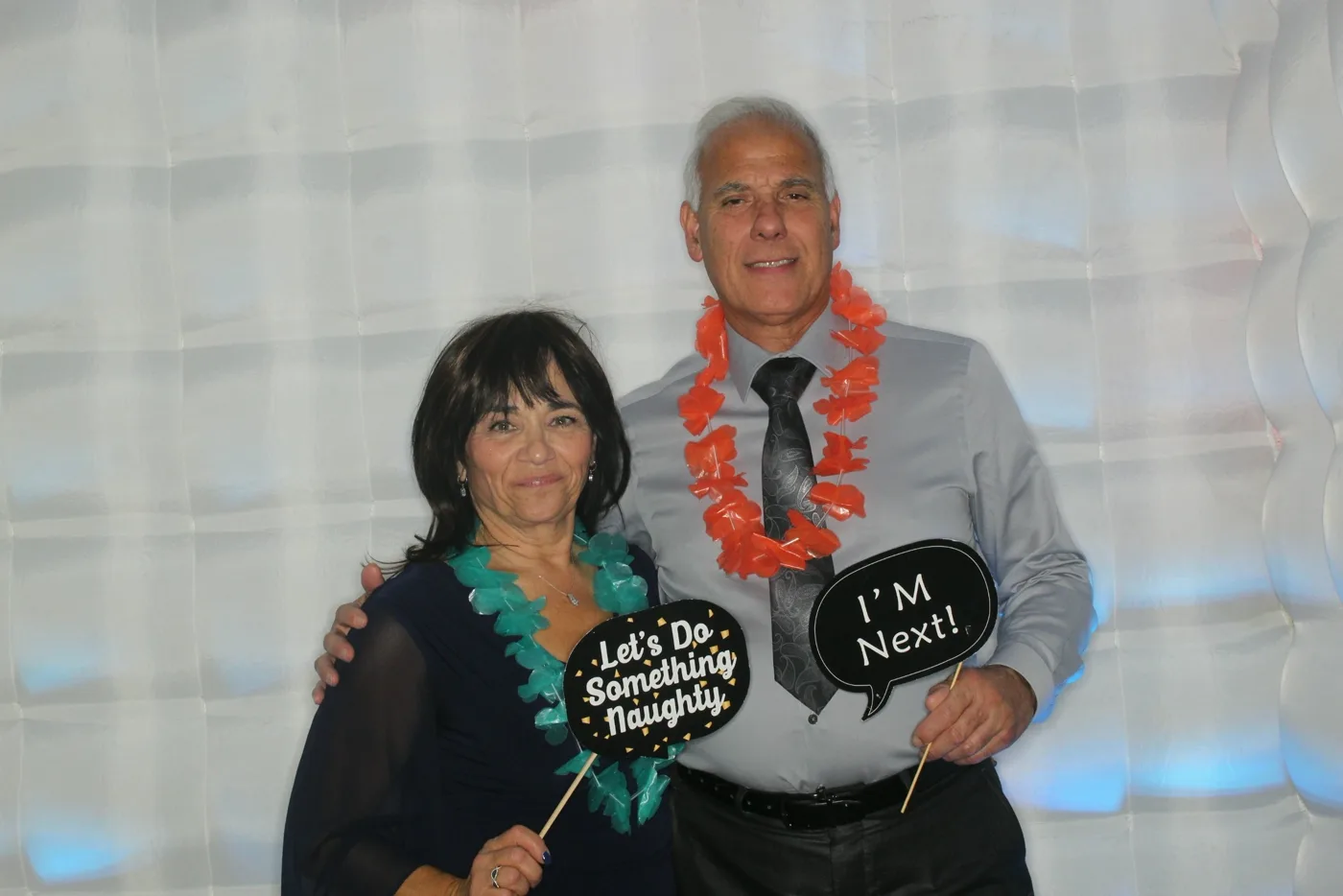 Couple celebrating in the photo booth