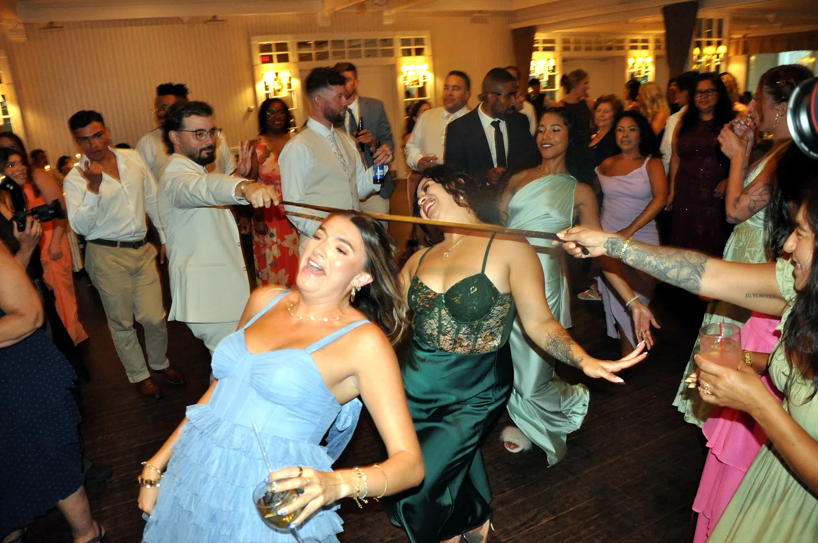 Wedding guests dancing on a packed dance floor
