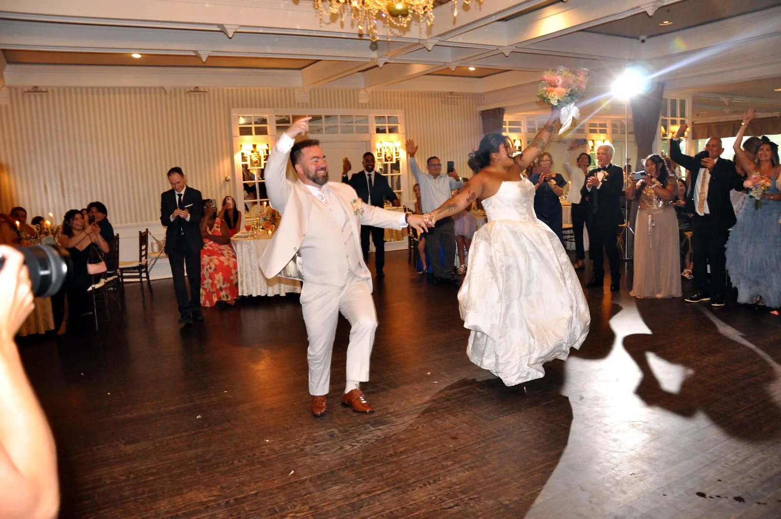 Newlyweds&rsquo; grand entrance announced by their MC at a Long Island wedding
