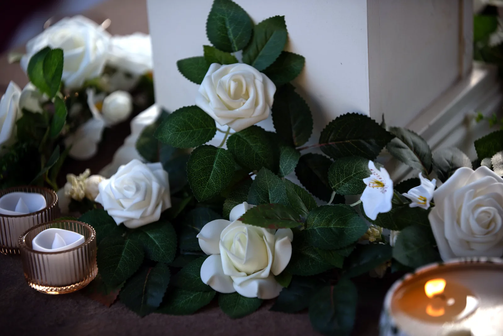 White roses and greenery centerpiece